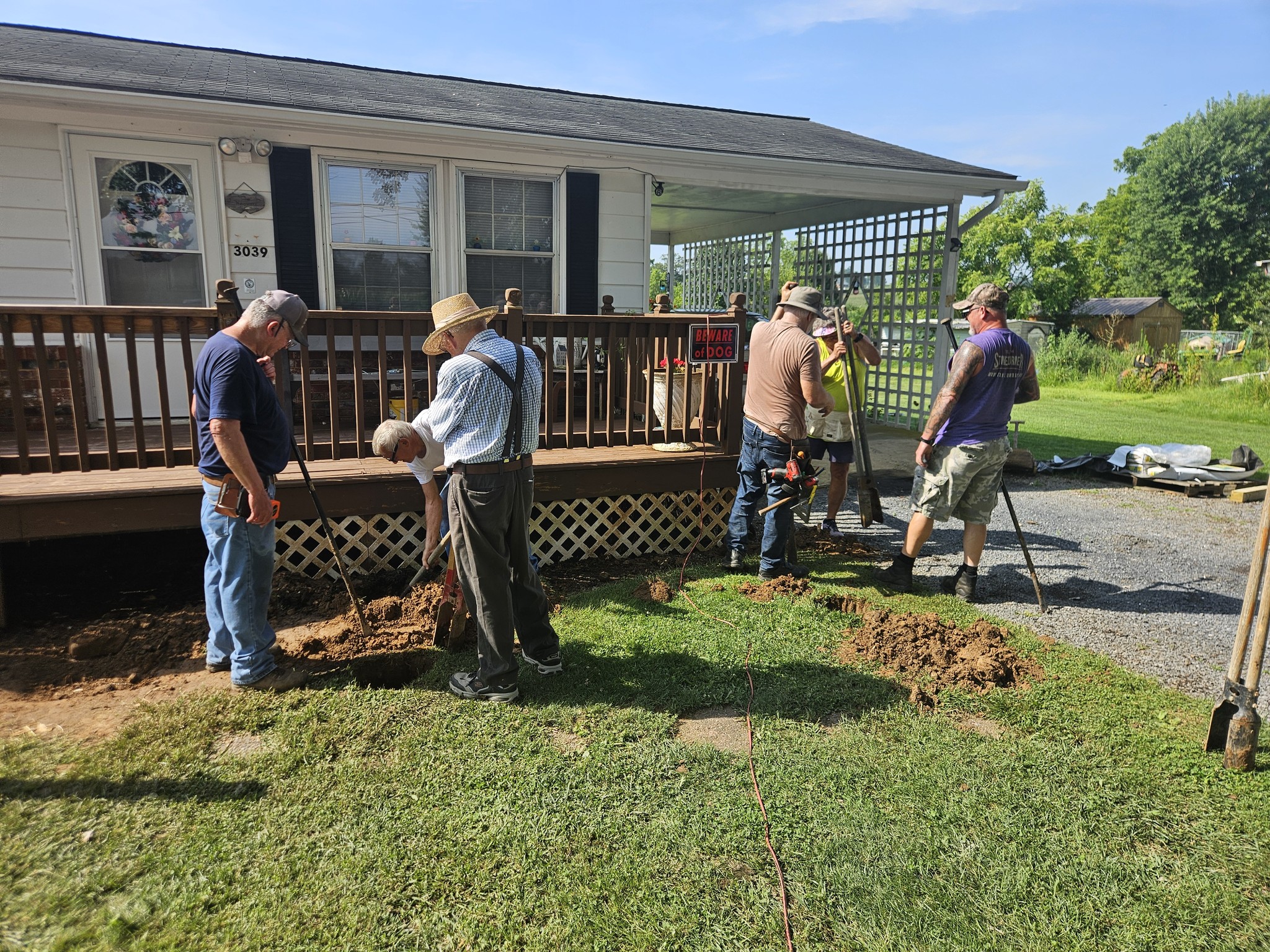 team working on a porch