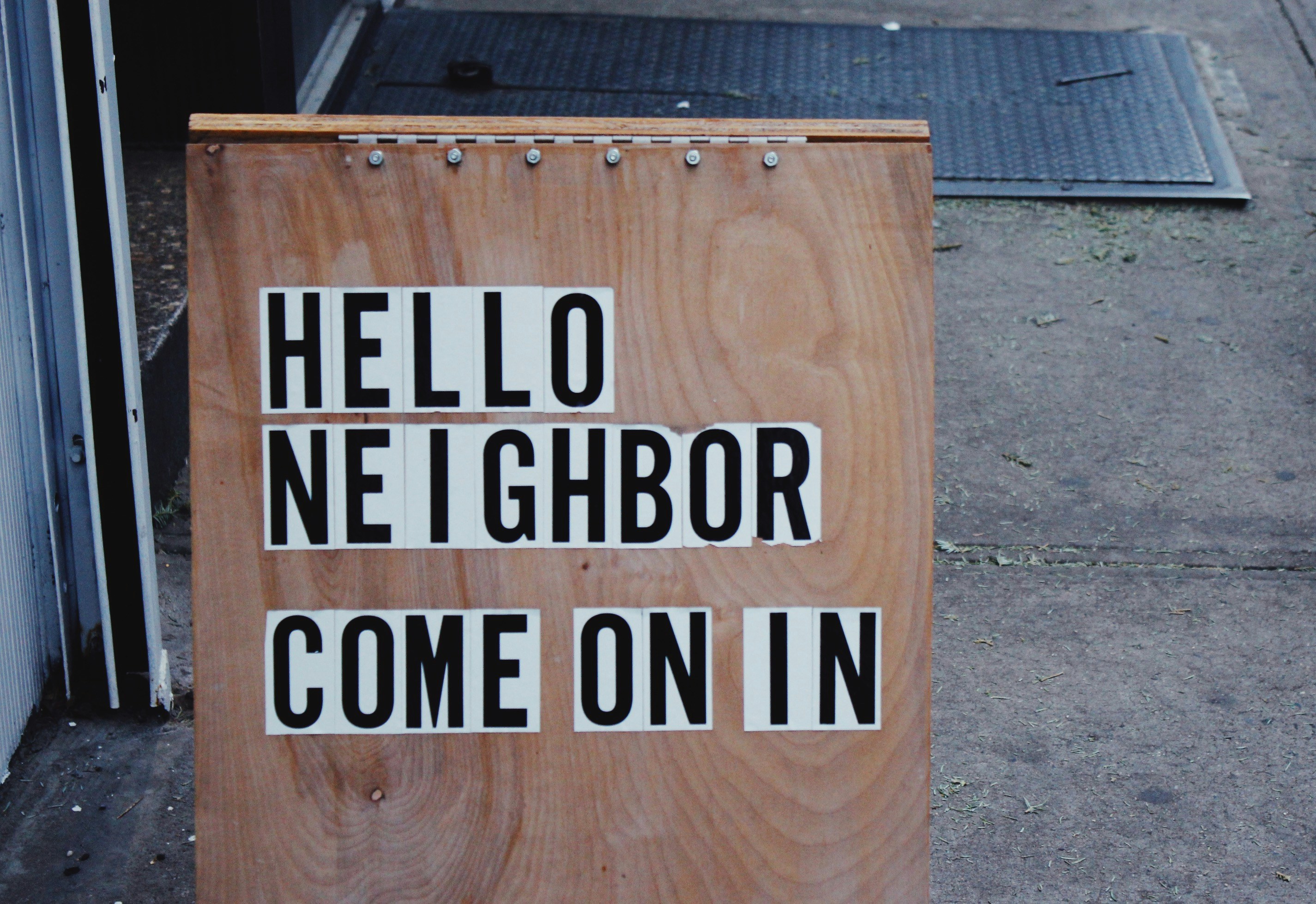 sign that says Hello Neighbor come on in